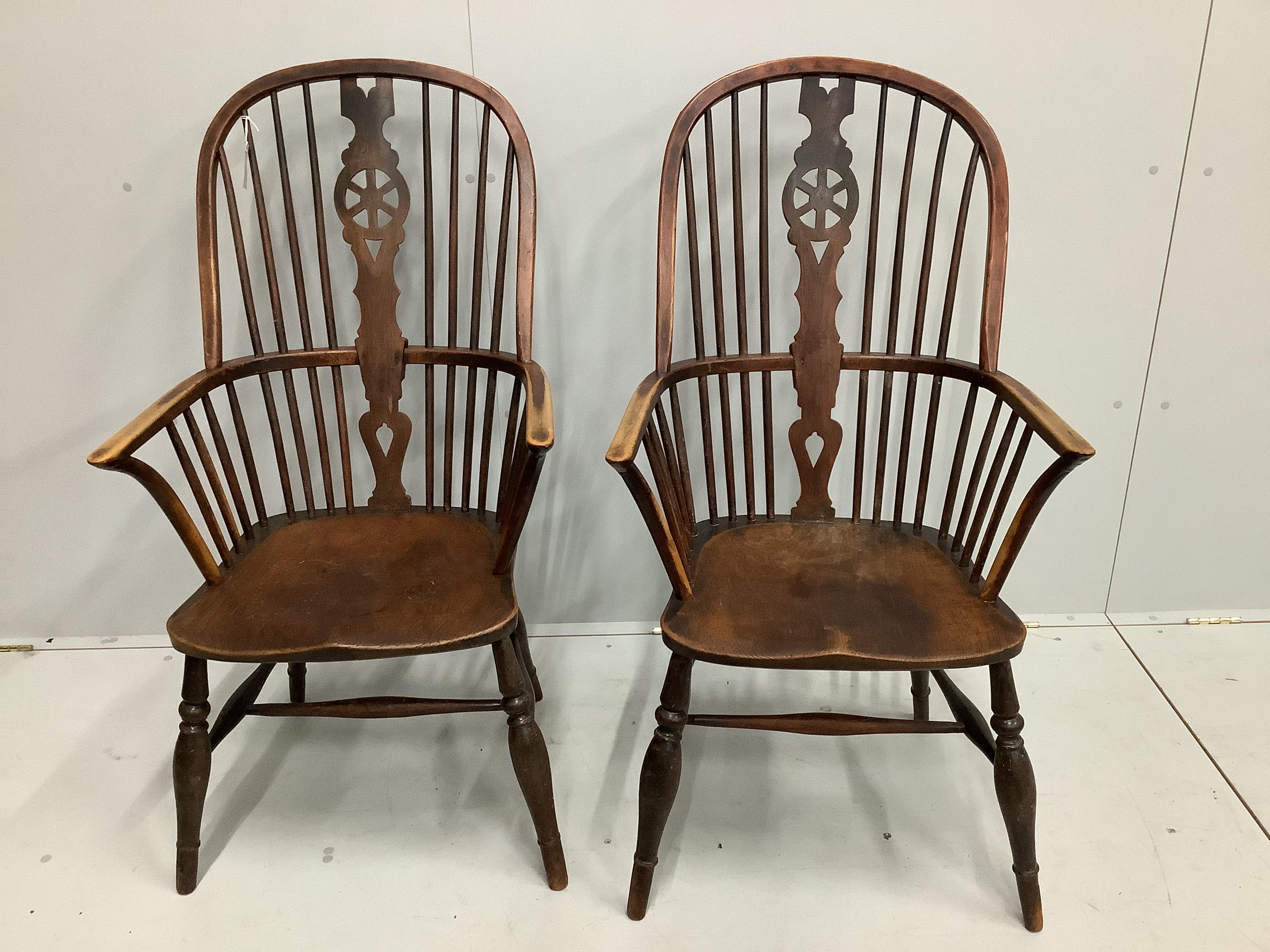 A pair of 19th century Thames Valley elm and beech Windsor wheelback armchairs, width 59cm, depth 43cm, height 114cm